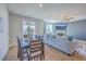 Open concept dining area adjacent to the living room, featuring natural light and hardwood floors at 215 Shortmarsh St, Summerville, SC 29486