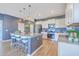 Bright kitchen with stainless steel appliances, granite countertops, white cabinets, and a center island at 215 Shortmarsh St, Summerville, SC 29486