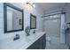 Bright bathroom with double sink vanity, shiplap walls, and modern fixtures at 225 Camber Rd, Huger, SC 29450