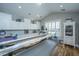 Spacious craft room with white cabinets, long countertops and lots of natural light at 225 Camber Rd, Huger, SC 29450