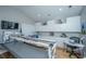 Large craft room with custom storage, work tables, and vaulted ceiling at 225 Camber Rd, Huger, SC 29450