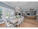 Beautiful dining room with hardwood floors and a stylish chandelier at 225 Camber Rd, Huger, SC 29450