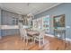 Charming dining room with modern lighting and hardwood floors at 225 Camber Rd, Huger, SC 29450