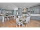 Open dining area with hardwood floors, stylish lighting, and view to the kitchen at 225 Camber Rd, Huger, SC 29450