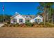 Inviting front yard with green lawn and beautiful home in a desirable community at 225 Camber Rd, Huger, SC 29450