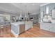 Open concept kitchen with stainless appliances and island open to dining and living areas at 225 Camber Rd, Huger, SC 29450
