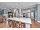 Kitchen island with quartz counters and stainless appliances; counter seating and pendant lighting at 225 Camber Rd, Huger, SC 29450