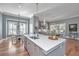 Kitchen island with stainless dishwasher, sink, and views to dining and living areas at 225 Camber Rd, Huger, SC 29450
