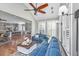 Open-concept living room with large sectional, ceiling fan, and views to the kitchen at 225 Camber Rd, Huger, SC 29450