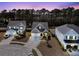 Spacious neighborhood features homes with garages and landscaping at 225 Waning Way, Charleston, SC 29492