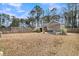 Expansive backyard with a shed and a charming pergola-covered patio, ideal for outdoor living at 225 Waning Way, Charleston, SC 29492