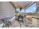 Cozy backyard patio with outdoor seating under a charming pergola, perfect for enjoying outdoor meals at 225 Waning Way, Charleston, SC 29492