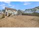 Large backyard with outdoor seating and a fire pit, perfect for entertaining guests and Gathering at 225 Waning Way, Charleston, SC 29492