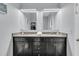 Lovely bathroom featuring a double vanity, granite countertops, and decorative mirrors at 225 Waning Way, Charleston, SC 29492