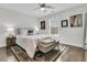 Bright bedroom with a queen bed, ceiling fan, decorative rug, and natural light through the large window at 225 Waning Way, Charleston, SC 29492