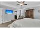 Relaxing bedroom showcasing an ensuite bath and stylish flat screen television at 225 Waning Way, Charleston, SC 29492