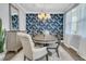 Stylish dining room with a chandelier, accent wall, and a dining set perfect for gatherings at 225 Waning Way, Charleston, SC 29492