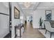 Elegant foyer with hardwood floors, a crystal chandelier, and stylish decor accents at 225 Waning Way, Charleston, SC 29492