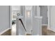 Hallway with wood floors, stairway and a modern chandelier, perfect for a welcoming space at 225 Waning Way, Charleston, SC 29492