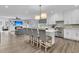 Well-designed kitchen overlooking living area, complete with modern appliances, island seating, and ample cabinetry at 225 Waning Way, Charleston, SC 29492