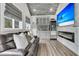Stylish living area featuring a wet bar, modern fireplace, and comfortable seating at 225 Waning Way, Charleston, SC 29492