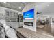 Comfortable living area with a fireplace, large TV, and a stylish wet bar area at 225 Waning Way, Charleston, SC 29492