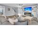 Inviting living room with a modern fireplace, large sectional sofa, and easy access to the staircase at 225 Waning Way, Charleston, SC 29492