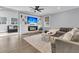 Bright living room features a cozy fireplace, built-in shelving, and comfortable seating area with natural light at 225 Waning Way, Charleston, SC 29492