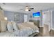 Stylish main bedroom with decorative furnishings, mounted TV, ceiling fan, and ample natural light at 225 Waning Way, Charleston, SC 29492