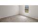 Bright bedroom with neutral carpet and a window offering natural light at 229 Coral Sunset Way, Summerville, SC 29486
