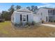 Charming single-story home featuring light blue siding, a one-car garage, and tidy landscaping at 229 Coral Sunset Way, Summerville, SC 29486