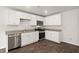 A modern kitchen with white cabinets, stainless steel appliances, and wood-look flooring at 229 Coral Sunset Way, Summerville, SC 29486