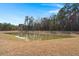 Scenic view of the pond surrounded by trees, enhancing the property's natural beauty at 229 Coral Sunset Way, Summerville, SC 29486