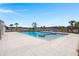 Resort-style swimming pool with sunning area and mature palm trees offers a relaxing oasis for residents at 229 Coral Sunset Way, Summerville, SC 29486