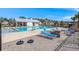 Community pool with sun loungers, a fire pit, and covered area provides an excellent outdoor gathering space at 229 Coral Sunset Way, Summerville, SC 29486