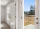 Patio view through an open door showing a pond and backyard at 229 Coral Sunset Way, Summerville, SC 29486