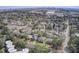 An aerial shot shows houses nestled among trees within a city, dotted with various architectural styles at 229 Gordon St, Charleston, SC 29403