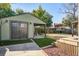 Well-maintained backyard with a garage, artificial grass, and a playhouse in the background at 229 Gordon St, Charleston, SC 29403