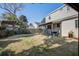 Spacious backyard featuring a playhouse, seating area, and mature landscaping at 229 Gordon St, Charleston, SC 29403