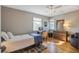Cozy bedroom with hardwood floors, ceiling fan, and neutral colors providing a relaxing atmosphere at 229 Gordon St, Charleston, SC 29403