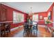Elegant dining room with hardwood floors, chandelier, and abundant natural light at 229 Gordon St, Charleston, SC 29403