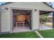 Open garage doors showcasing a recreational area with ping pong table and exterior covered patio at 229 Gordon St, Charleston, SC 29403