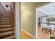 Hallway with a staircase and a view into a living room and dining area at 229 Gordon St, Charleston, SC 29403
