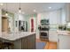 Bright and spacious kitchen with an island, stainless steel appliances, and ample counter space at 229 Gordon St, Charleston, SC 29403