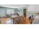 Eat-in kitchen features light-green painted walls, white cabinets, and a bright sunny window at 229 Gordon St, Charleston, SC 29403