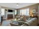 Cozy living room with a decorative fireplace, hardwood floors, and comfortable seating arrangement at 229 Gordon St, Charleston, SC 29403