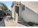 Side entrance of a charming home with a brick facade and well-maintained steps and landscaping at 229 Gordon St, Charleston, SC 29403