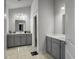 Spacious bathroom with a double sink vanity, tile floors, and a separate toilet area at 265 Celestial Blvd, Summerville, SC 29486