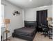 Cozy bedroom features dark furnishings, decorative wall art, and natural light from a window at 265 Celestial Blvd, Summerville, SC 29486