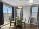 Dining room with modern table, green chairs, and lots of natural light from windows at 265 Celestial Blvd, Summerville, SC 29486